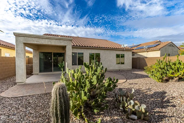 front view of a house with a bench