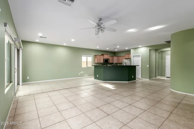 a view of an empty room and a window