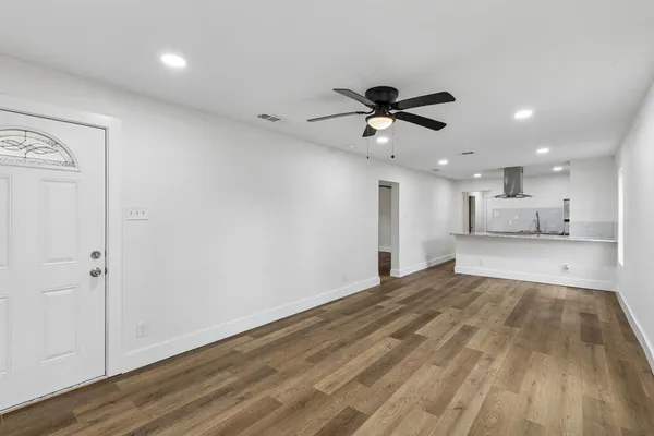 a view of kitchen with wooden floor and window