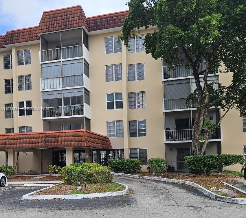 4172 Inverrary Drive, Unit 309 Lauderhill, FL 33319 - Photo 2 of 5 a front view of a building