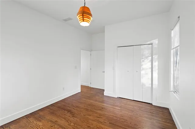 a view of a room with floor to ceiling windows and city view