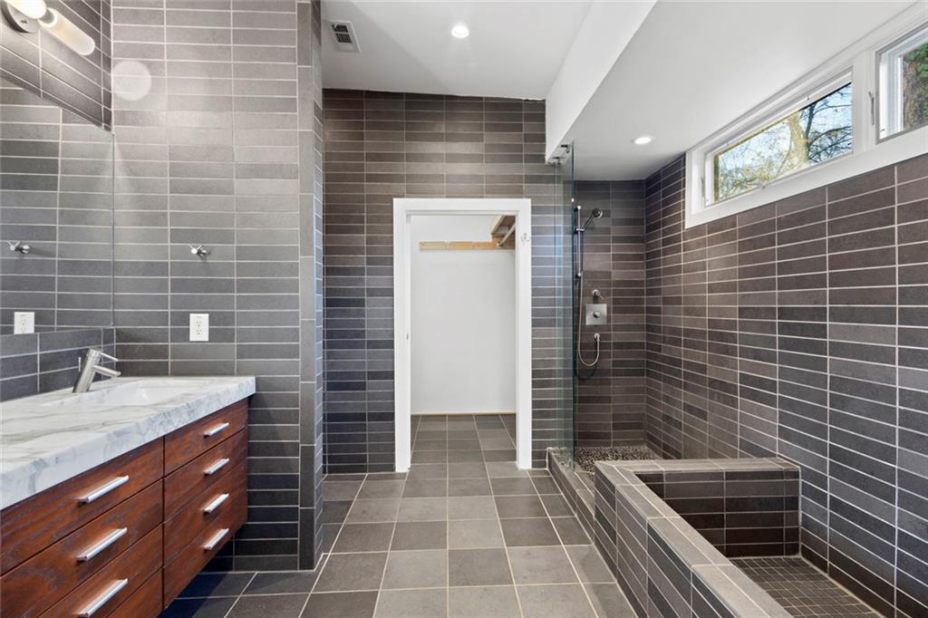 935 Custer Avenue Southeast Atlanta, GA 30316 - Photo 10 of 24 a bathroom with a sink a toilet and shower