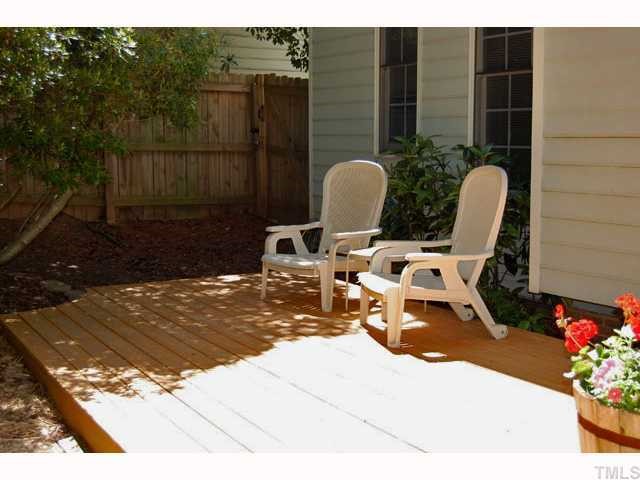 134 Solstice Circle Cary, NC 27513 - Photo 11 of 12 a view of a chair and tables in backyard of the house