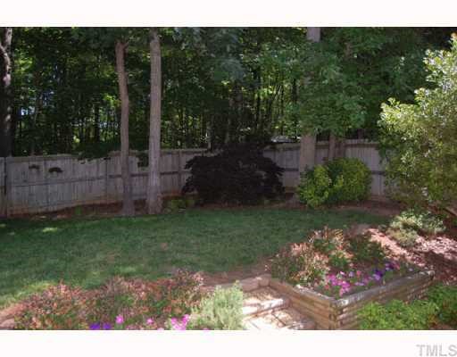 134 Solstice Circle Cary, NC 27513 - Photo 12 of 12 a view of a backyard with garden
