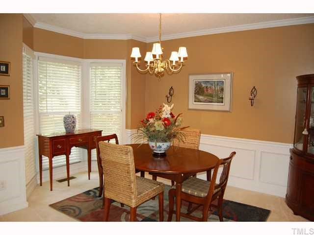 134 Solstice Circle Cary, NC 27513 - Photo 2 of 12 a view of a dining room with furniture and a chandelier