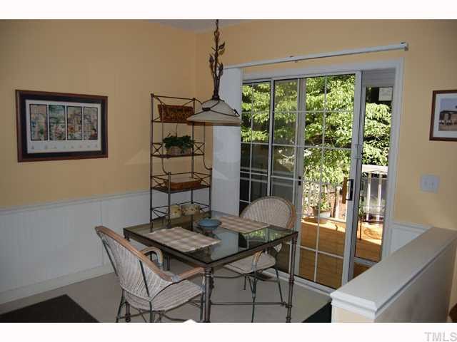 134 Solstice Circle Cary, NC 27513 - Photo 4 of 12 a view of a dining room with furniture window and outside view