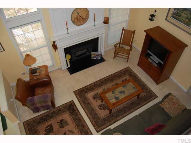 134 Solstice Circle Cary, NC 27513 - Photo 6 of 12 a living room with furniture and a fireplace