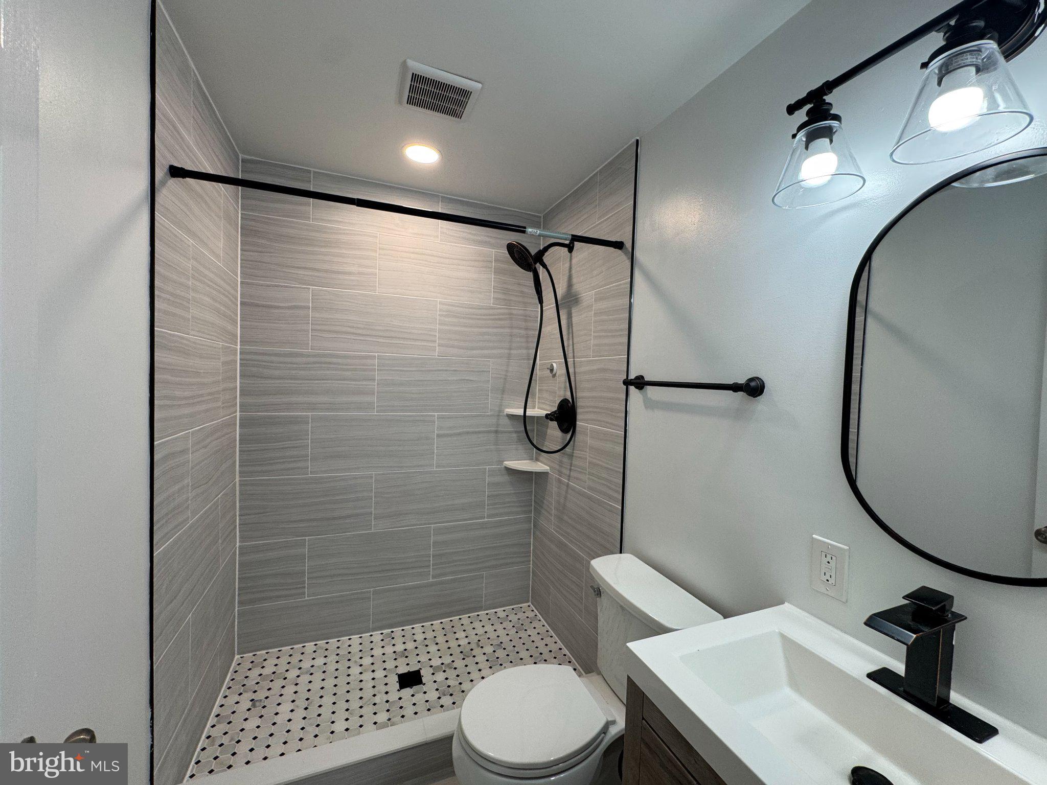 10542 Reed's Landing Circle Burke, VA 22015 - Photo 14 of 32 a bathroom with a sink toilet and shower