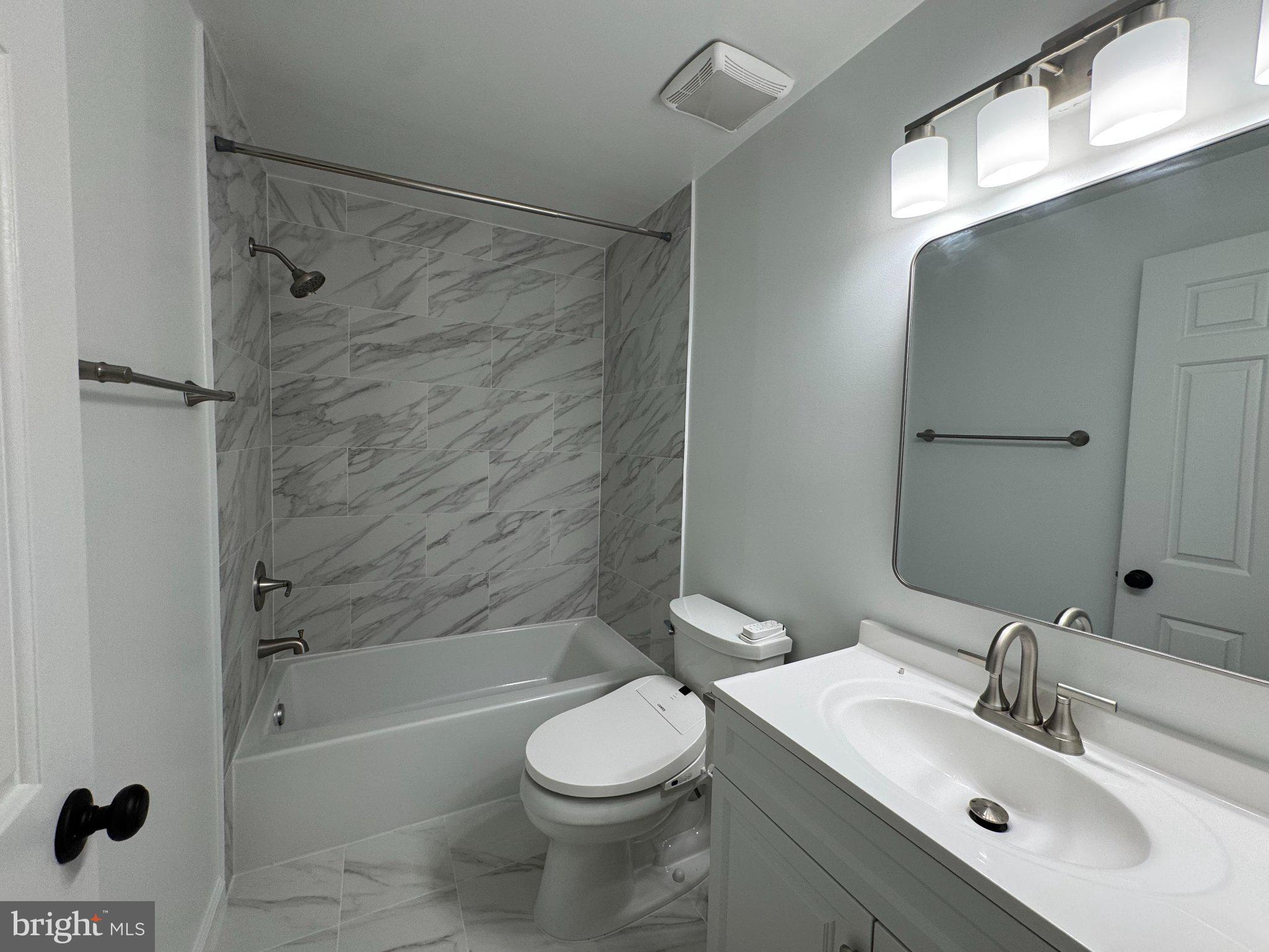 10542 Reed's Landing Circle Burke, VA 22015 - Photo 15 of 32 a bathroom with a sink toilet and shower