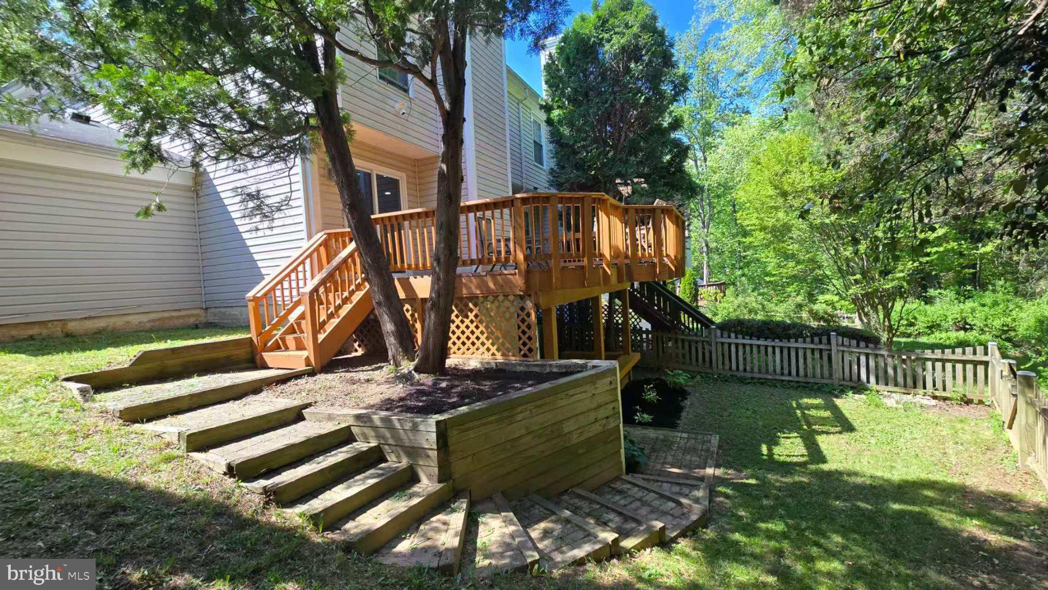10542 Reed's Landing Circle Burke, VA 22015 - Photo 23 of 32 a view of a house with backyard and sitting area