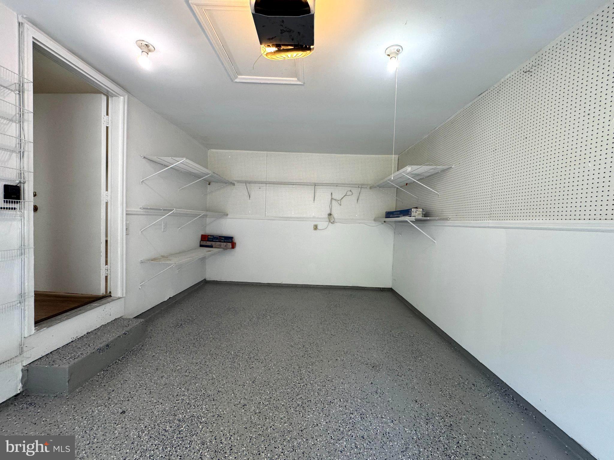10542 Reed's Landing Circle Burke, VA 22015 - Photo 32 of 32 an empty room with shelves and natural light