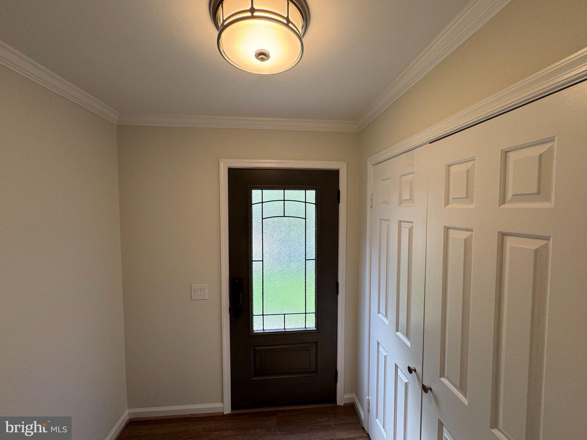 10542 Reed's Landing Circle Burke, VA 22015 - Photo 7 of 32 a view of a room with wooden floor and windows