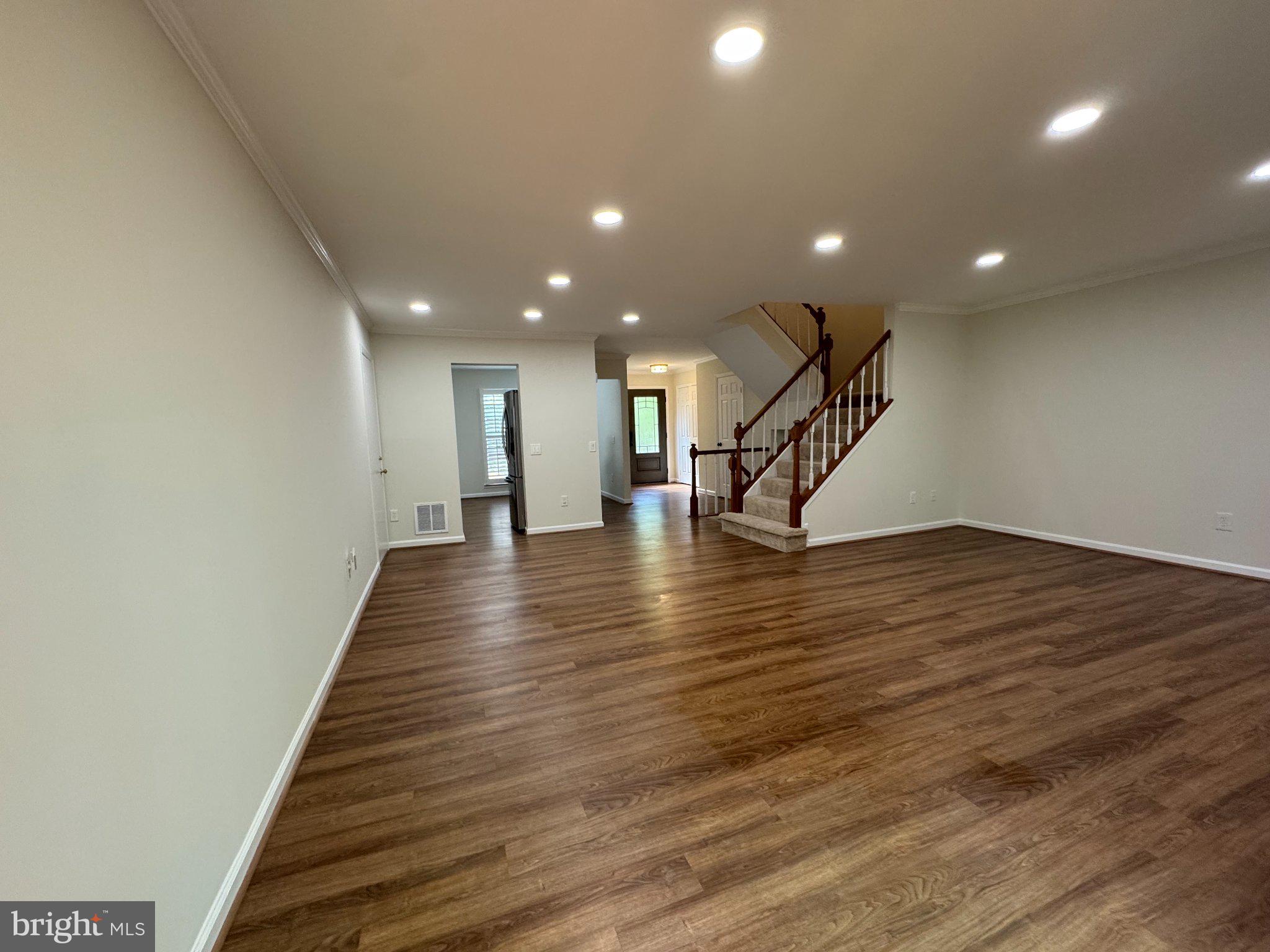 10542 Reed's Landing Circle Burke, VA 22015 - Photo 9 of 32 a view of an entryway with wooden floor