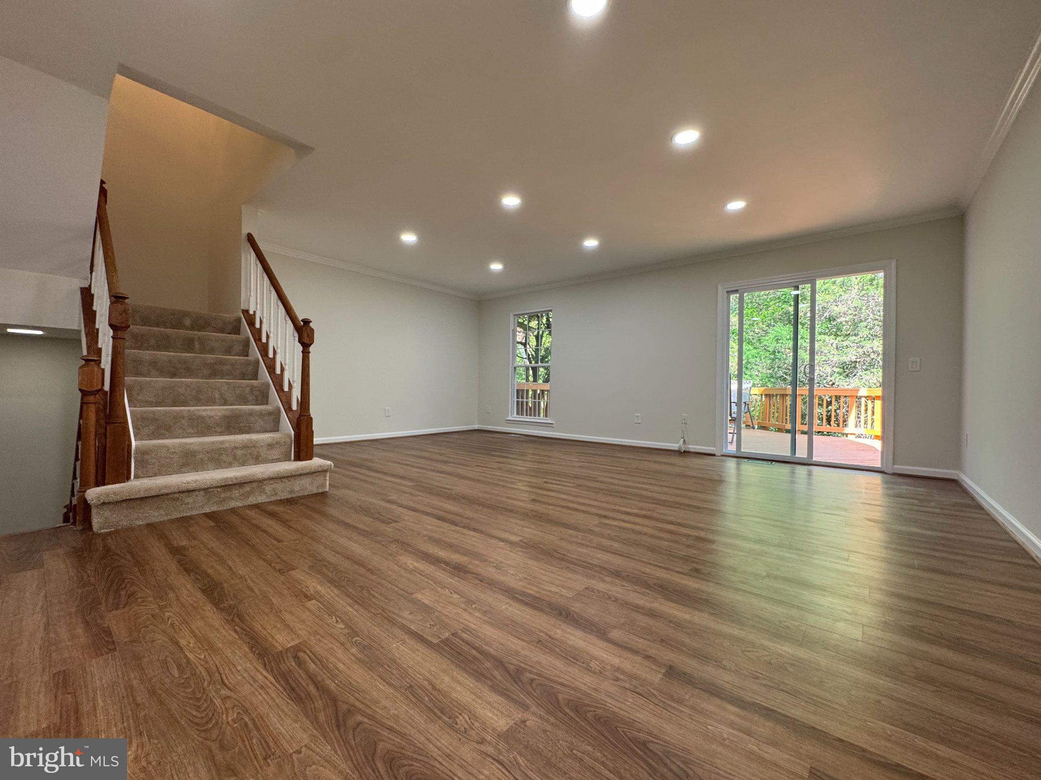 10542 Reed's Landing Circle Burke, VA 22015 - Photo 10 of 32 wooden floor in an empty room with a window