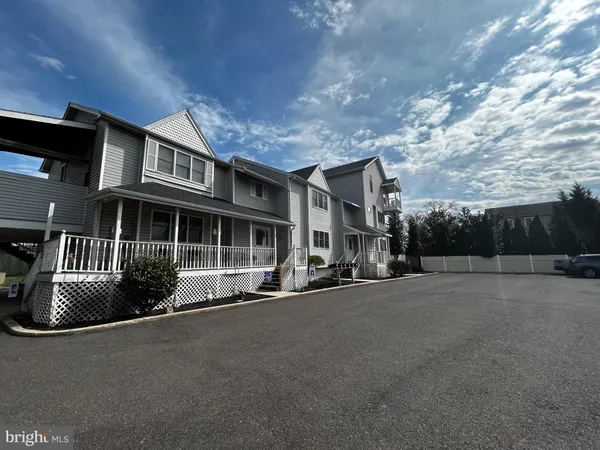 a front view of a house with garage