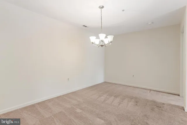 a bedroom with a bed a couch and a window