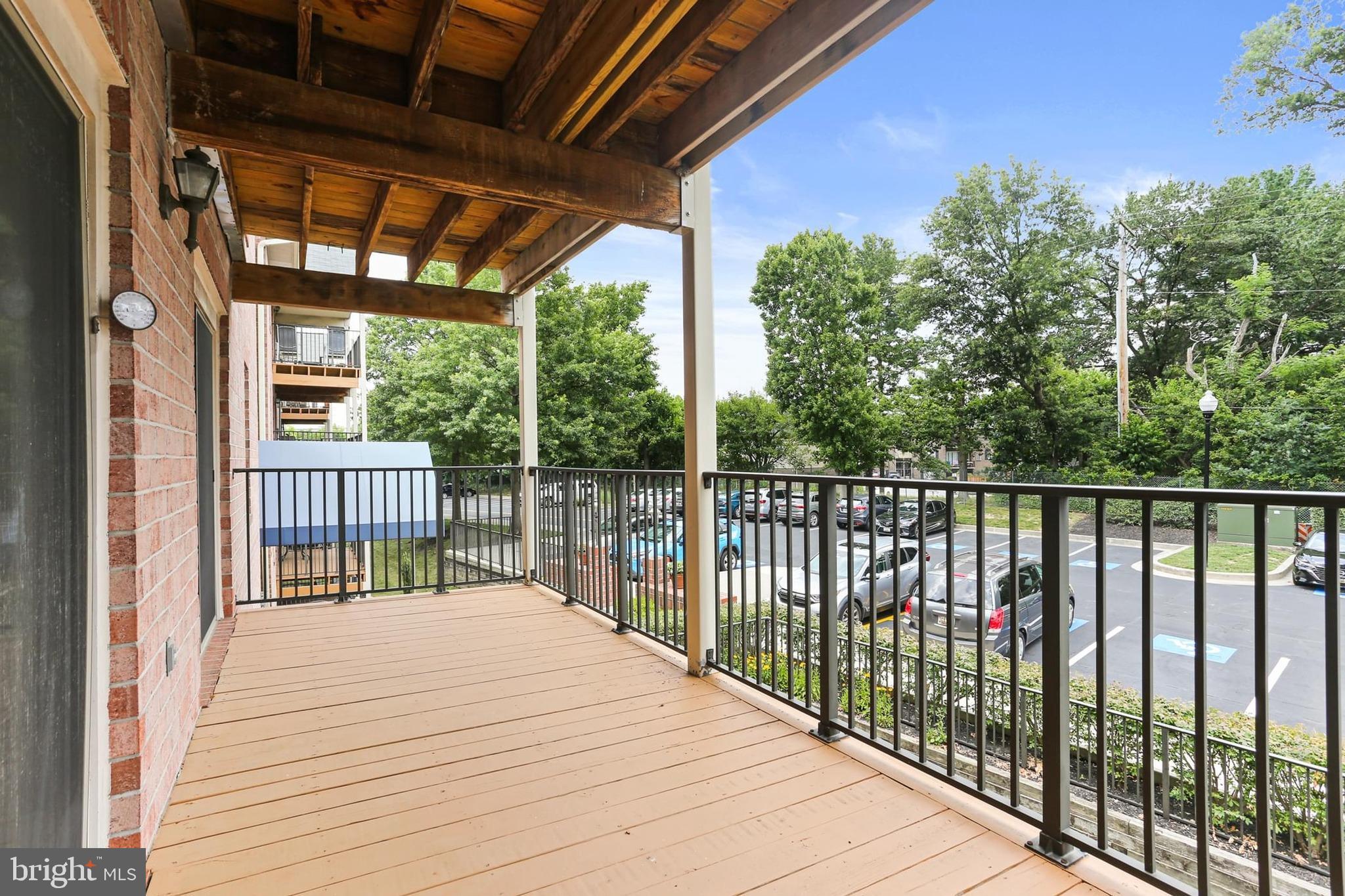 3907 Hannon Court, Unit 2A Baltimore, MD 21236 - Photo 21 of 34 a balcony with trees in front of it