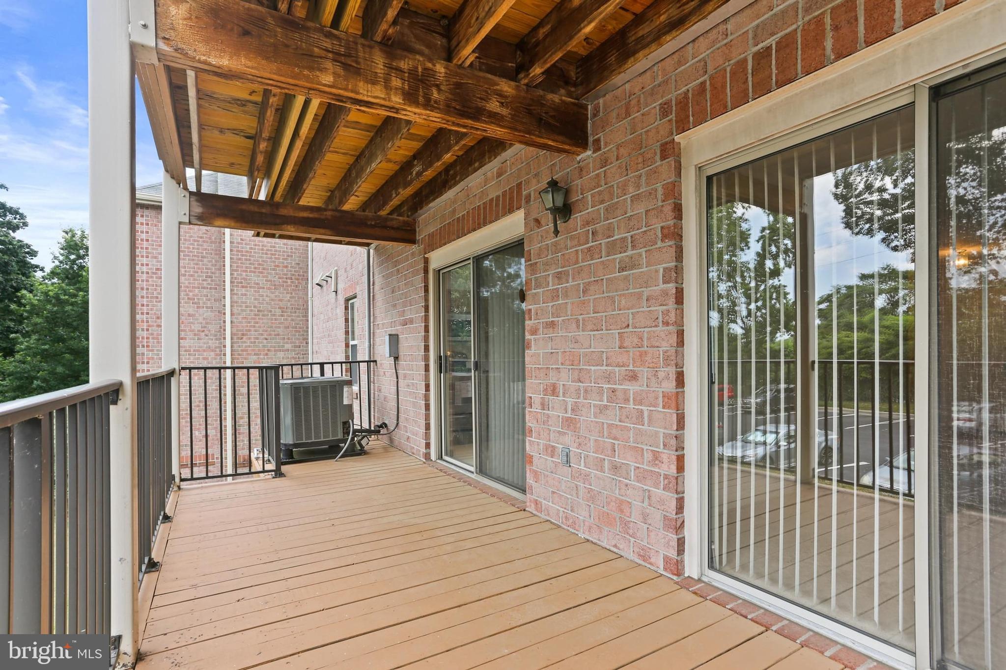 3907 Hannon Court, Unit 2A Baltimore, MD 21236 - Photo 22 of 34 a view of a balcony with wooden floor