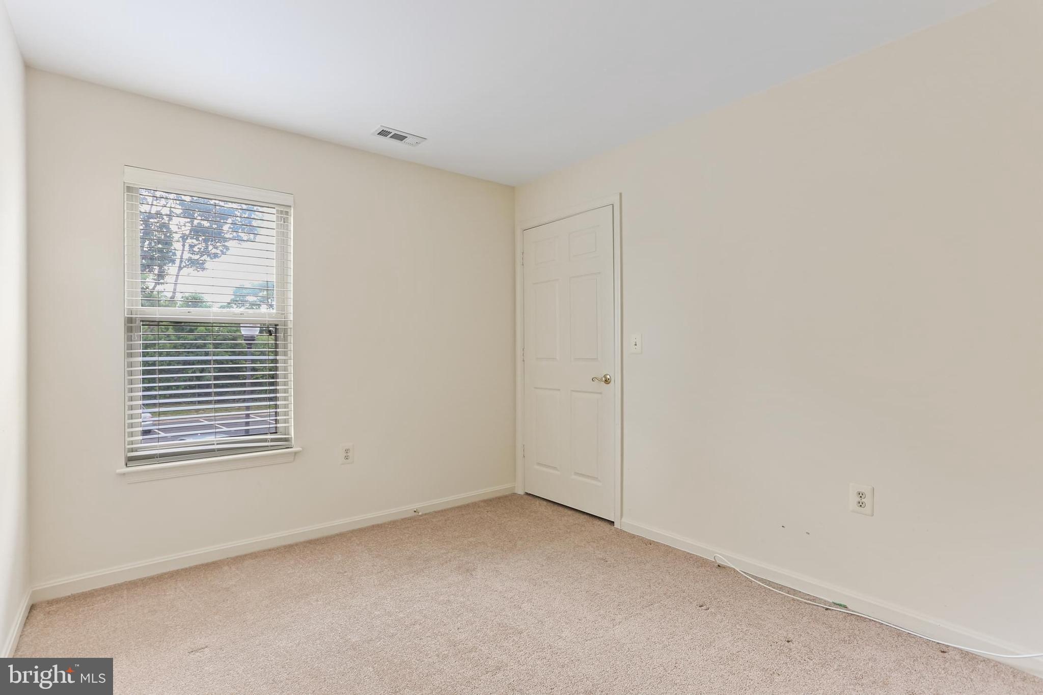 3907 Hannon Court, Unit 2A Baltimore, MD 21236 - Photo 23 of 34 a view of an empty room with a window