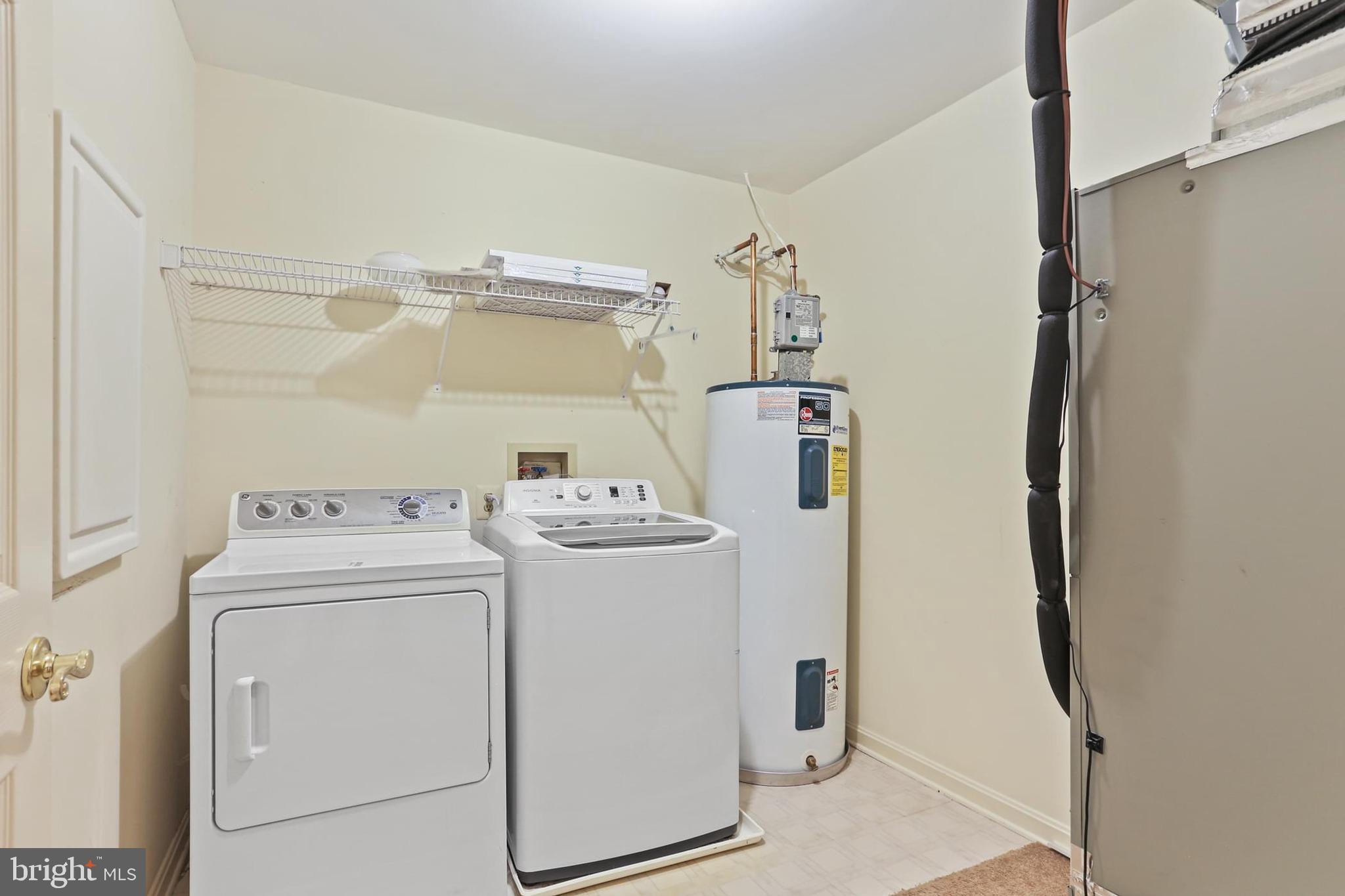 3907 Hannon Court, Unit 2A Baltimore, MD 21236 - Photo 30 of 34 a utility room with dryer and washer