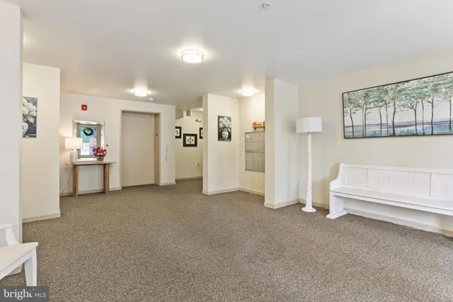 a view of hallway with livingroom
