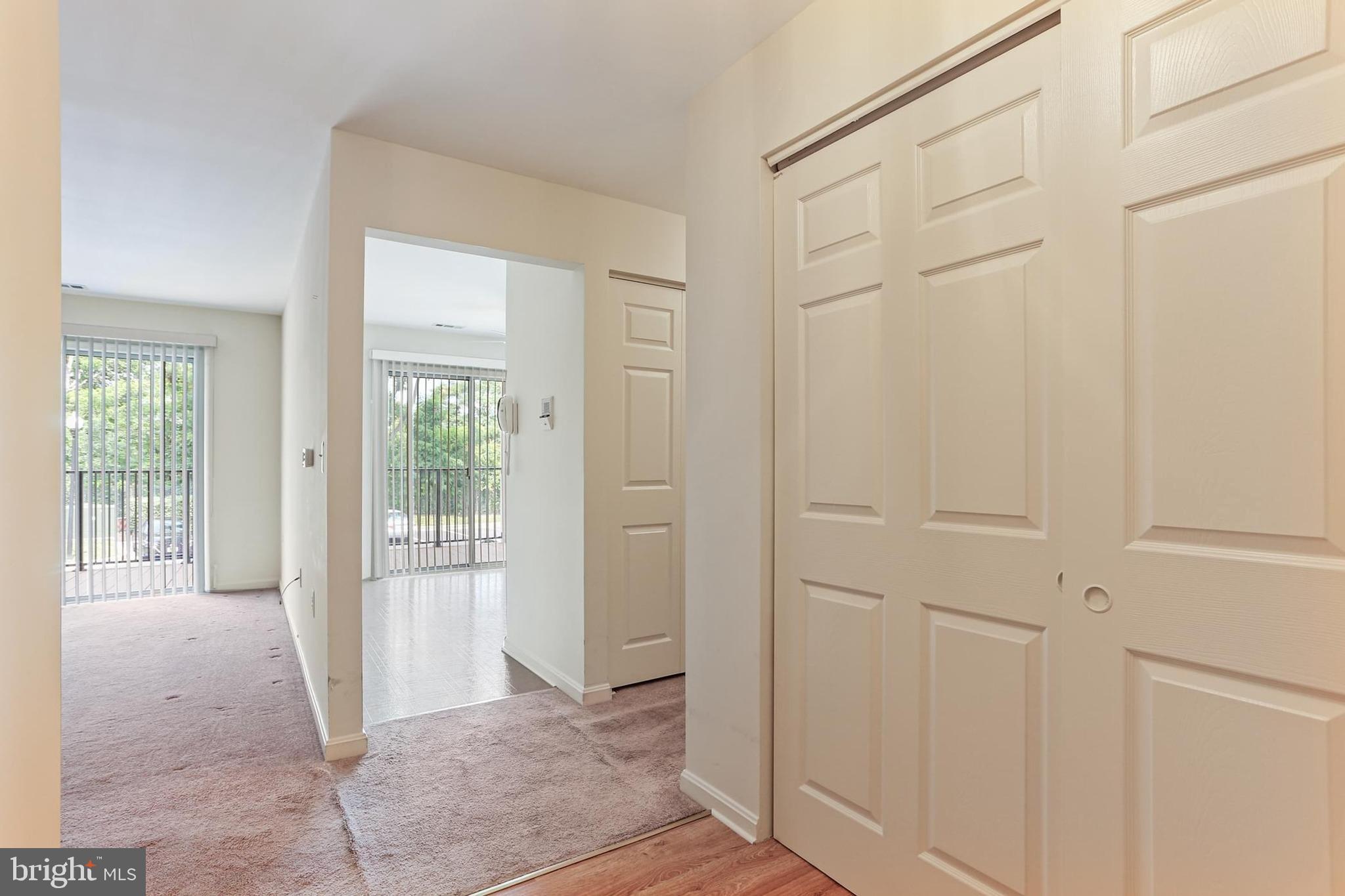 3907 Hannon Court, Unit 2A Baltimore, MD 21236 - Photo 5 of 34 a view of a hallway with wooden floor and a livingroom