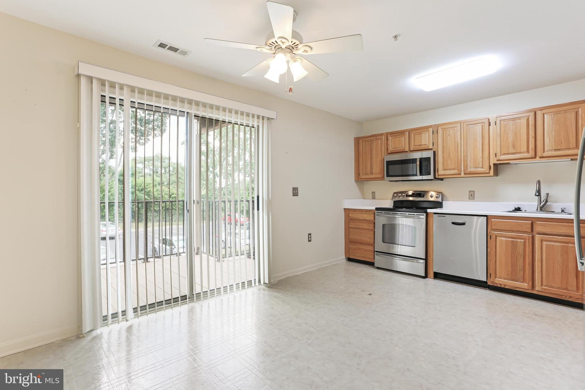3907 Hannon Court, Unit 2A Baltimore, MD 21236 - Photo 8 of 34 a kitchen with cabinets stainless steel appliances and a window