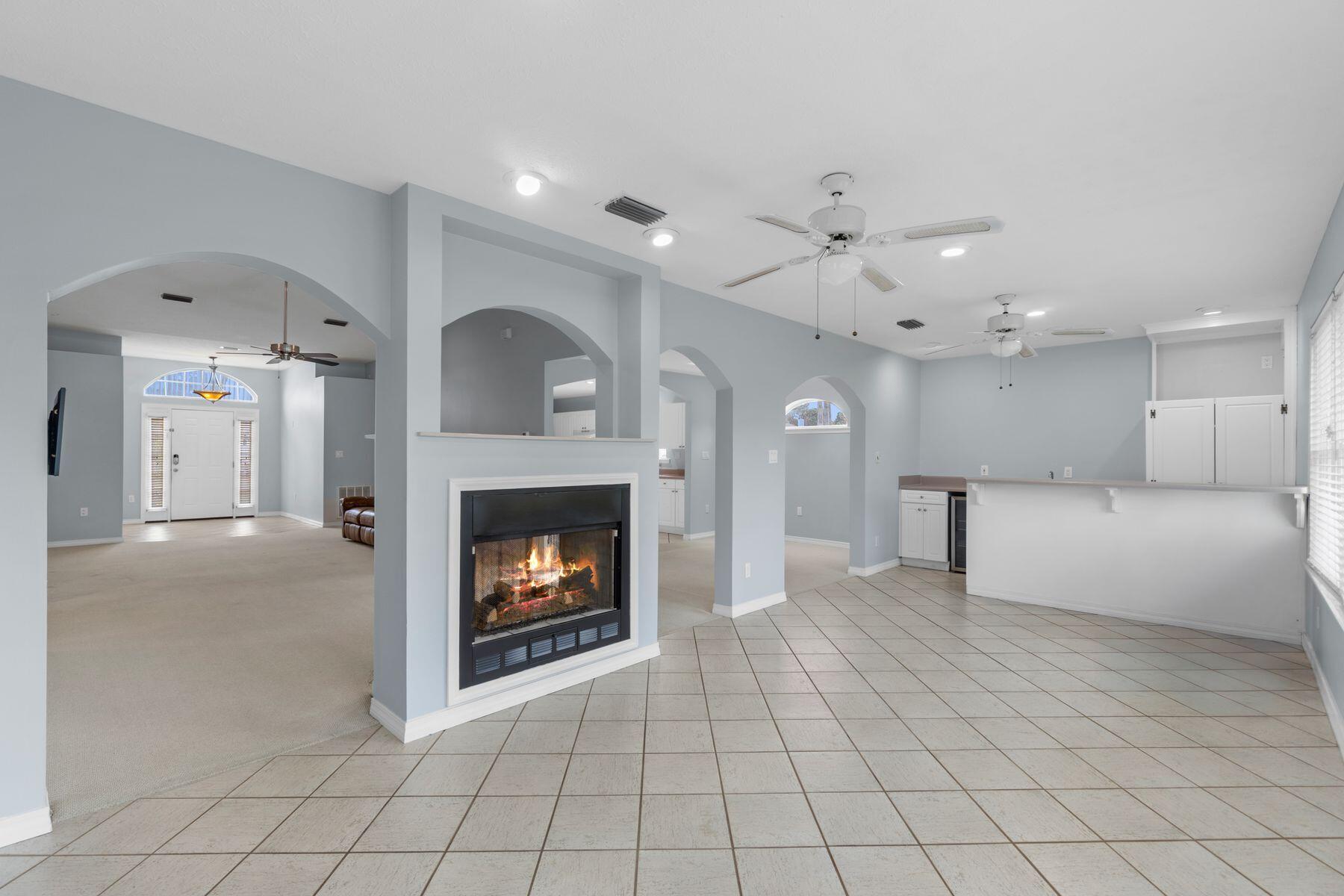 120 Hibiscus Lane Miramar Beach, FL 32550 - Photo 13 of 57 a view of an empty room with kitchen and fireplace