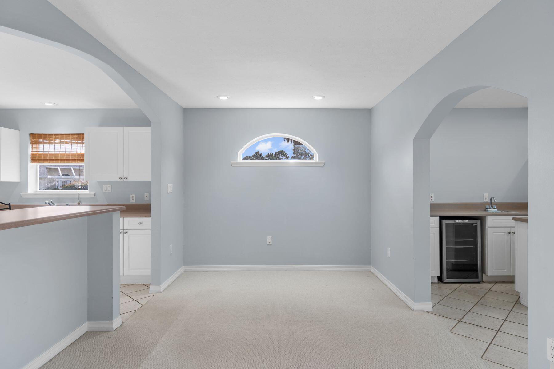 120 Hibiscus Lane Miramar Beach, FL 32550 - Photo 15 of 57 a view of an empty room with a kitchen