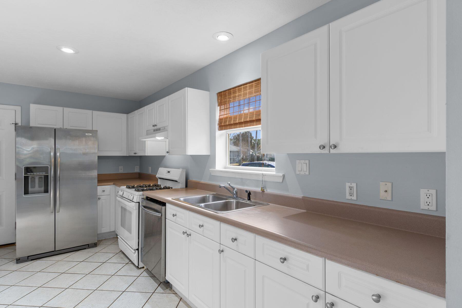 120 Hibiscus Lane Miramar Beach, FL 32550 - Photo 18 of 57 a kitchen with a sink appliances and cabinets