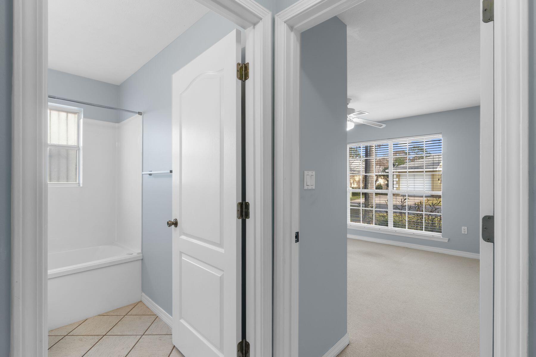 120 Hibiscus Lane Miramar Beach, FL 32550 - Photo 26 of 57 a bathroom with a tub shower and a sink
