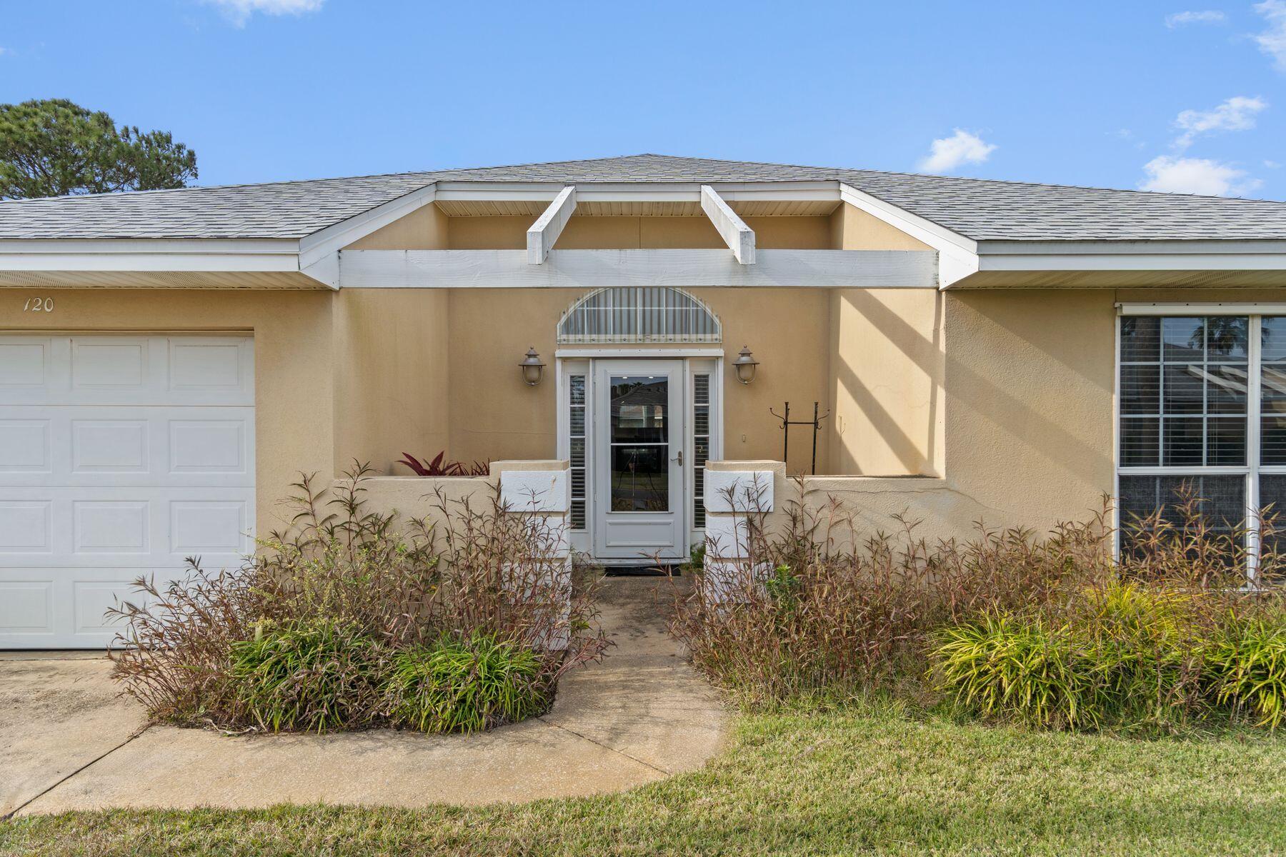 120 Hibiscus Lane Miramar Beach, FL 32550 - Photo 4 of 57 a front view of a house with garden