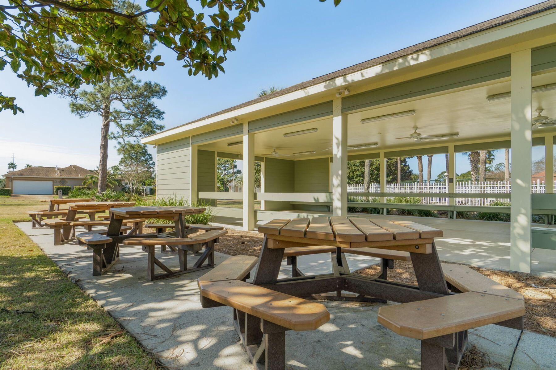 120 Hibiscus Lane Miramar Beach, FL 32550 - Photo 41 of 57 a couple of benches sitting in front of a building