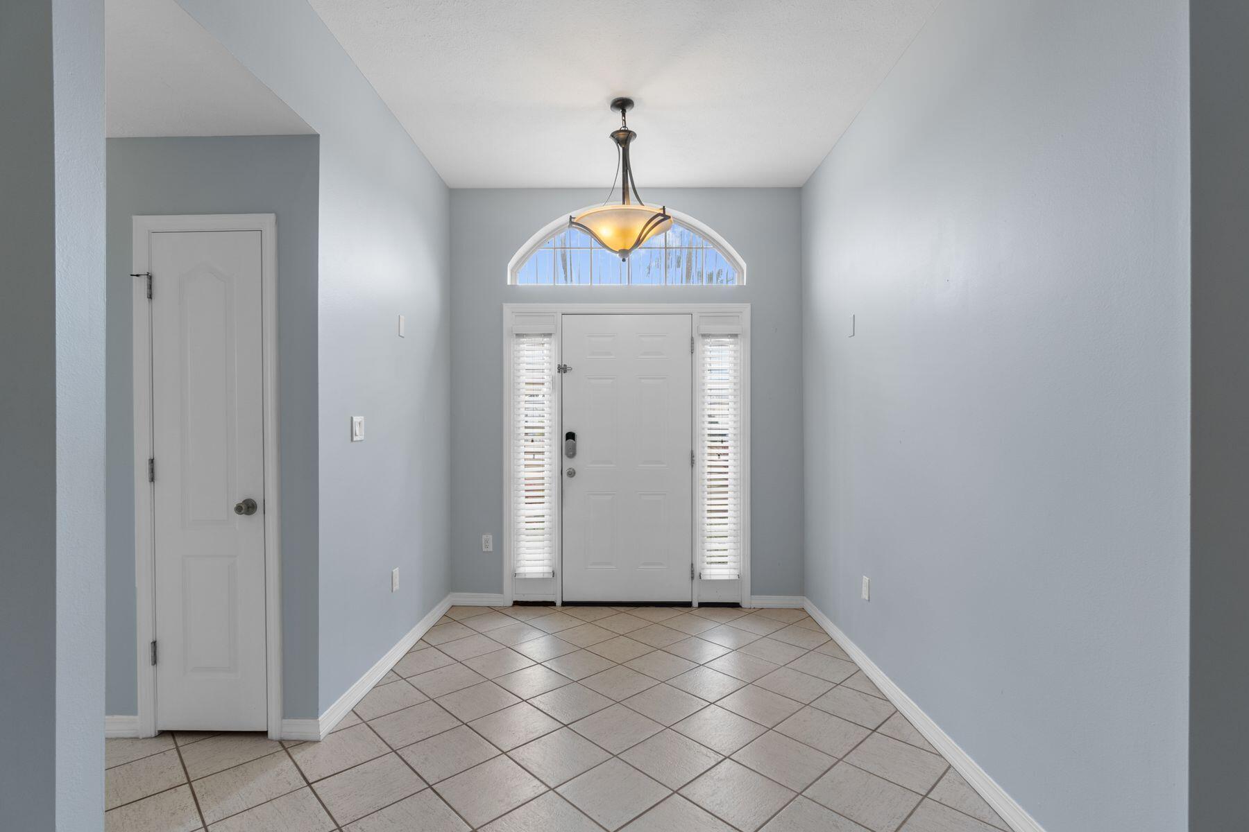 120 Hibiscus Lane Miramar Beach, FL 32550 - Photo 5 of 57 an empty room with wooden floor and windows
