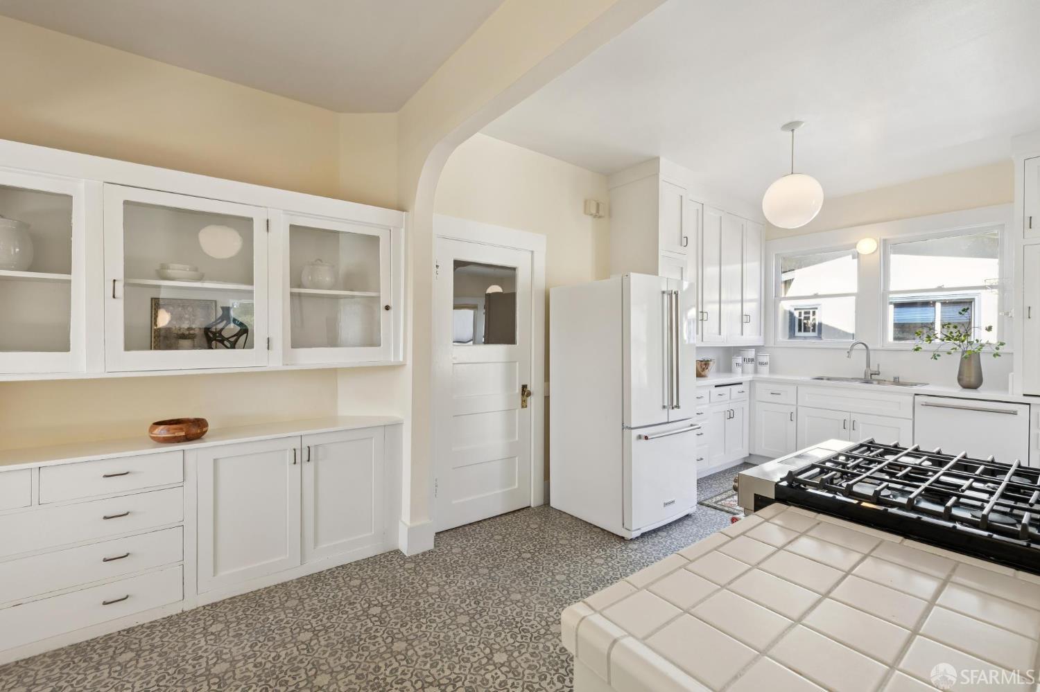 1968 Marin Avenue Berkeley, CA 94707 - Photo 26 of 75 a kitchen with white cabinets and white appliances