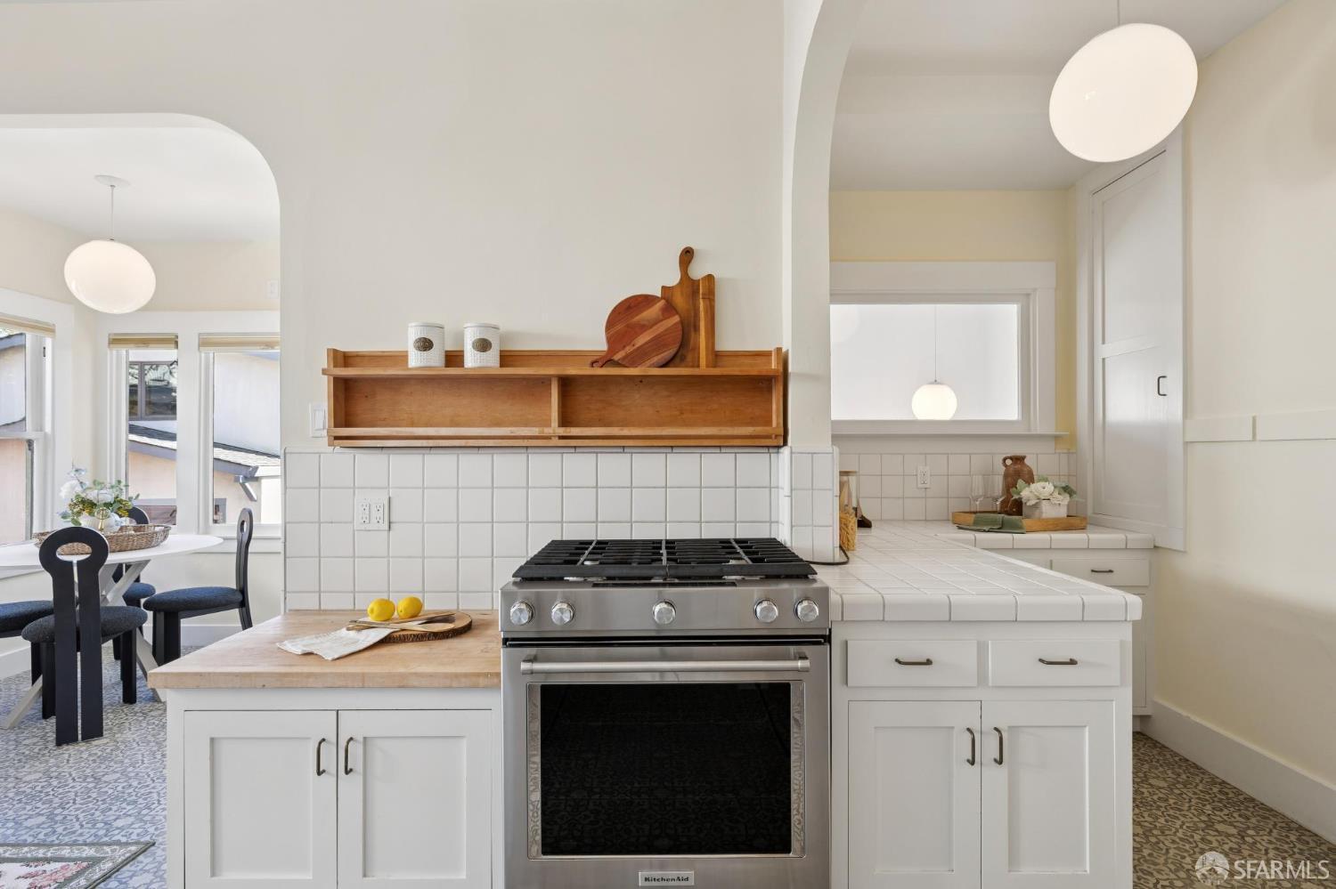 1968 Marin Avenue Berkeley, CA 94707 - Photo 30 of 75 a kitchen with stainless steel appliances granite countertop a stove a sink and a microwave