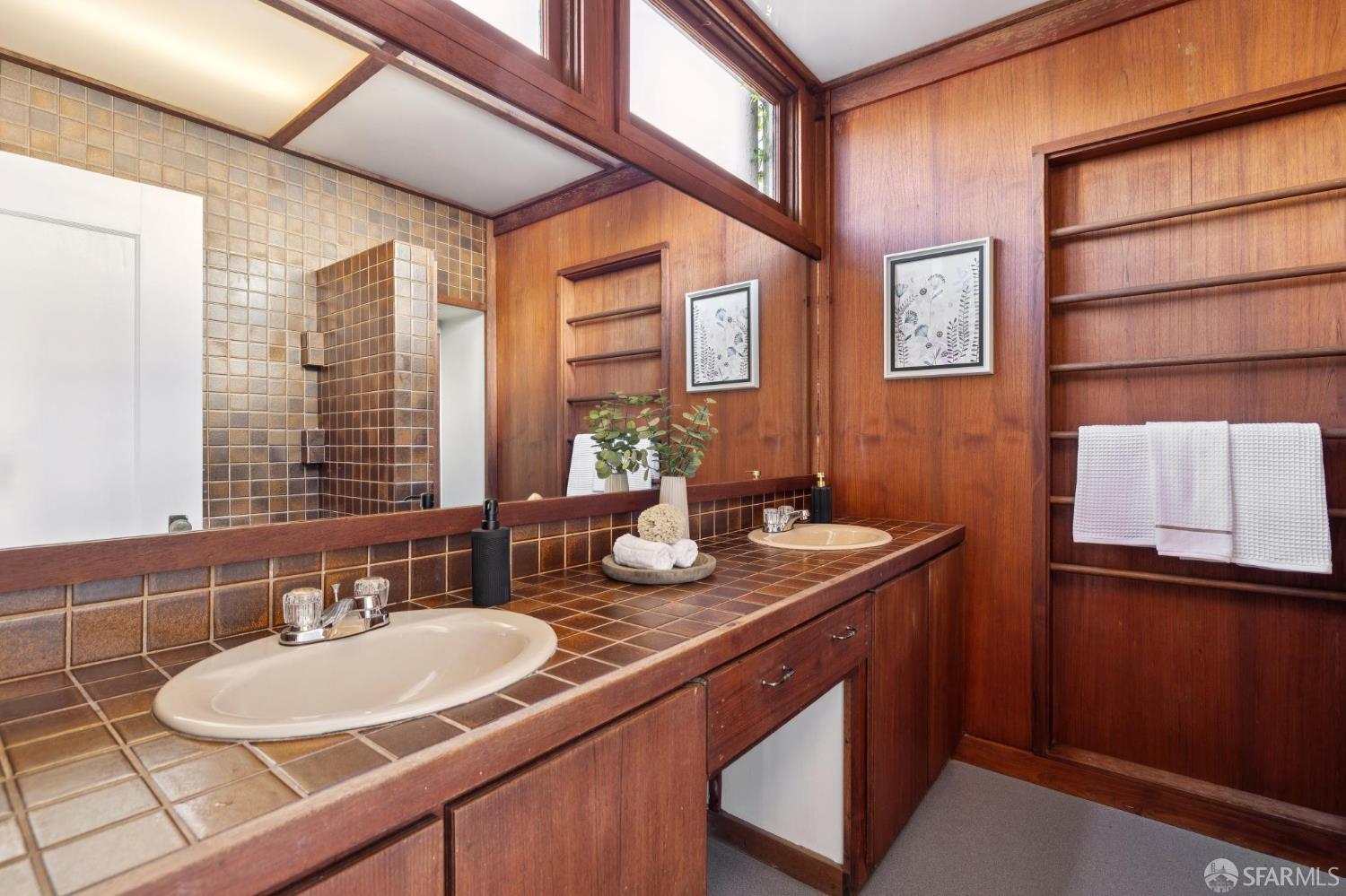1968 Marin Avenue Berkeley, CA 94707 - Photo 36 of 75 a bathroom with a granite countertop sink and a mirror