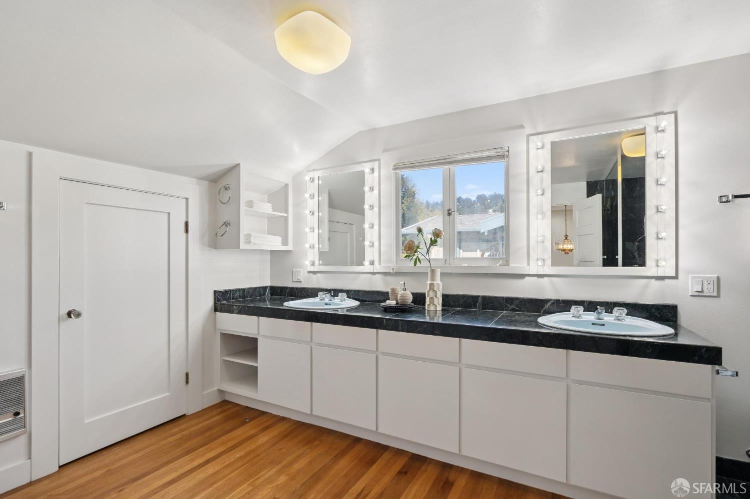 1968 Marin Avenue Berkeley, CA 94707 - Photo 46 of 75 a kitchen with granite countertop a sink and cabinets with wooden floor