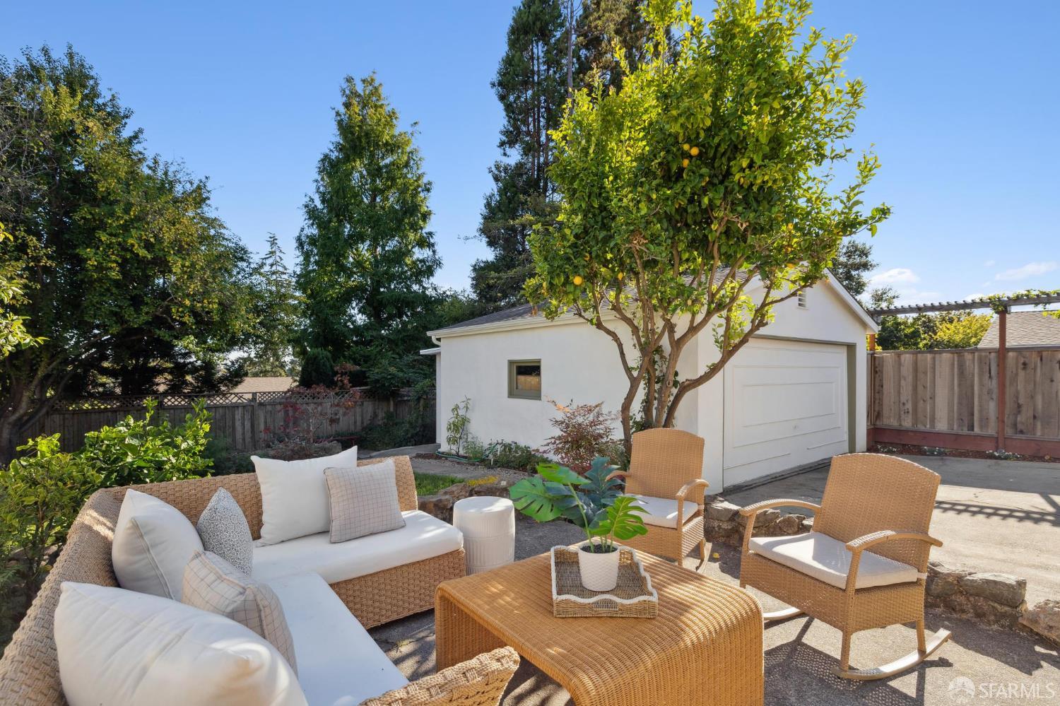1968 Marin Avenue Berkeley, CA 94707 - Photo 70 of 75 a backyard of a house with table and chairs