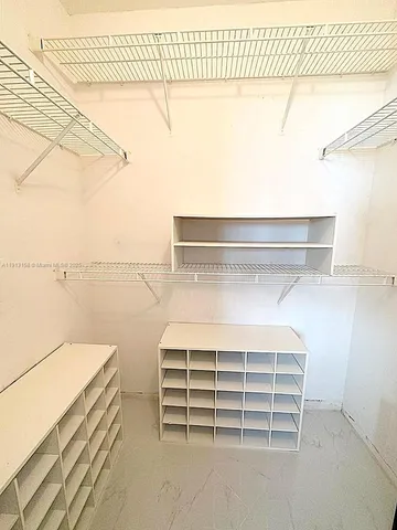 a view of a room with racks on the wall