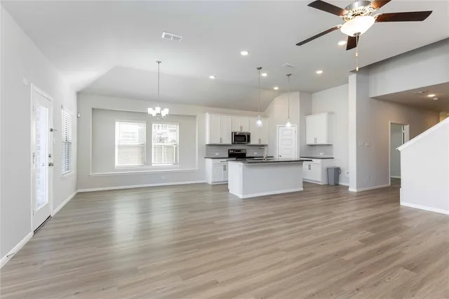 a view of multiple houses with yard