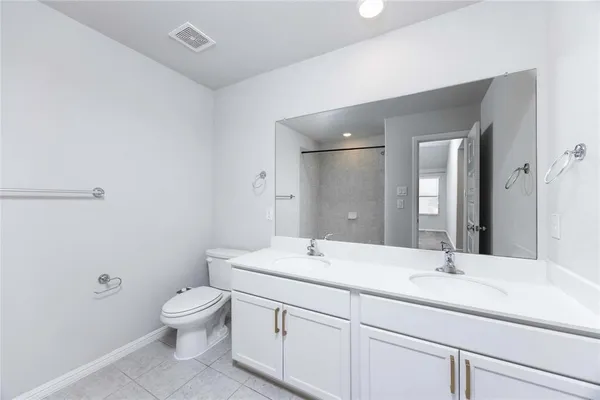 an empty room with an entryway and closet