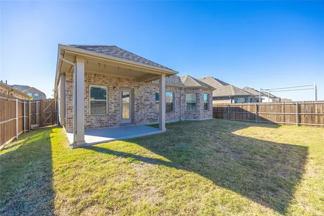 a view of swimming pool with a house in the background