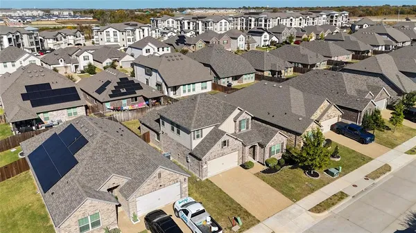 an aerial view of a house with a swimming pool