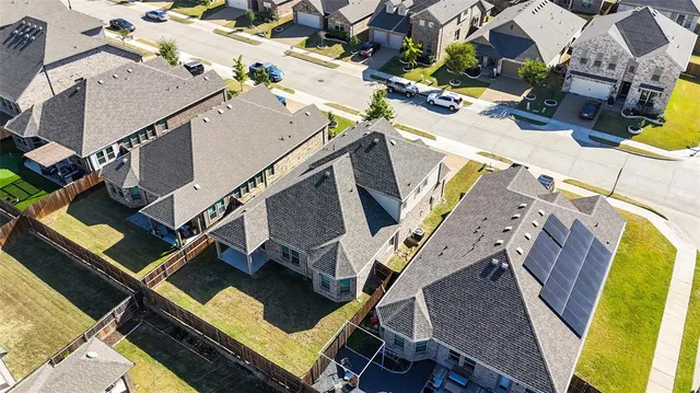 an aerial view of a building with beach and ocean view