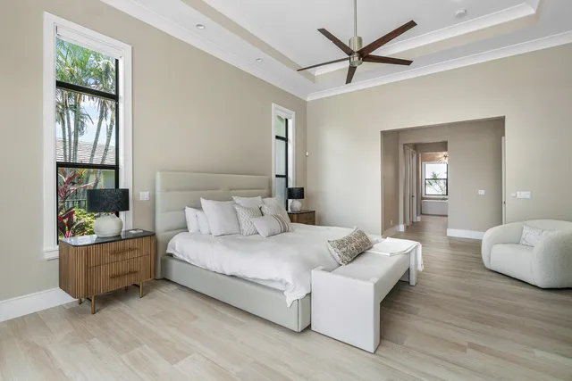 a bathroom with a bathtub shower sink vanity and mirror
