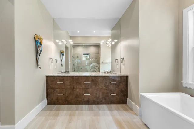a bathroom with a granite countertop sink mirror and double