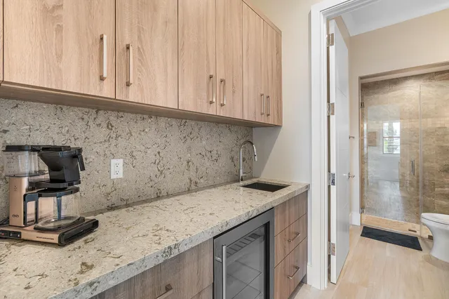 a living room with couches a coffee table and a flat screen tv