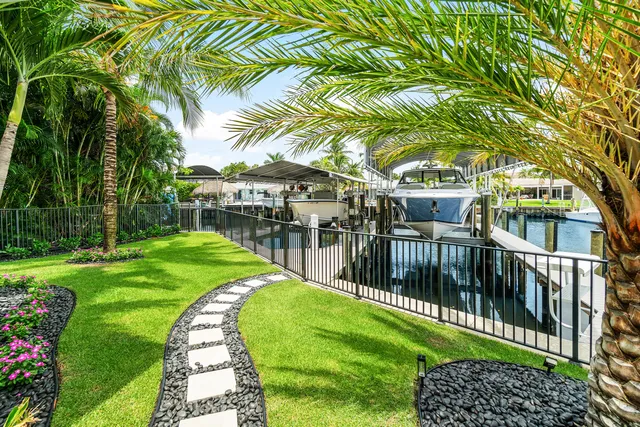 an aerial view of multiple houses with yard