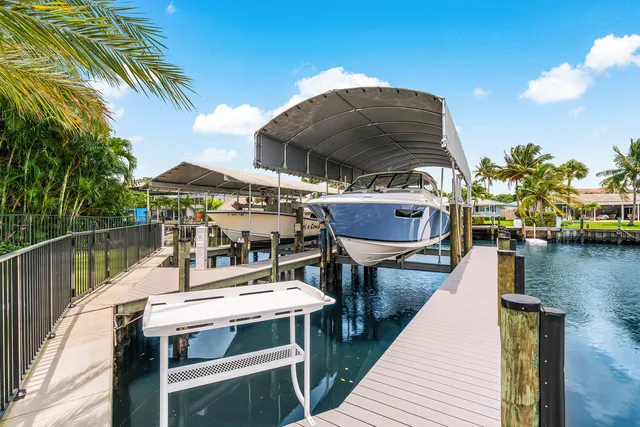 an aerial view of a house with yard swimming pool and outdoor seating